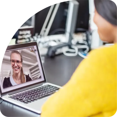 Person participating in a video call on a laptop